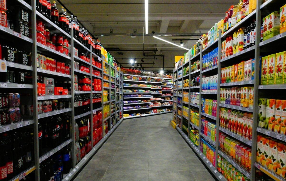 Supermarket grocery aisles representing household prices and consumer price inflation