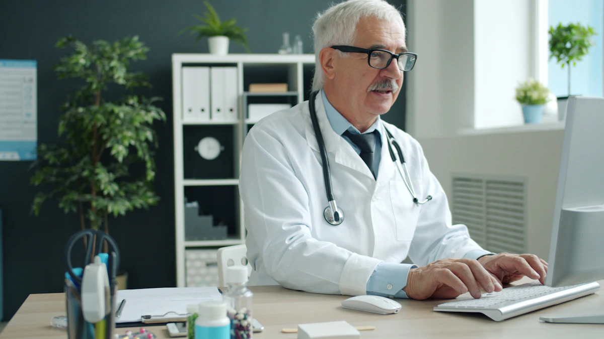 Hospital medical specialist using a computer to review patient and claim records