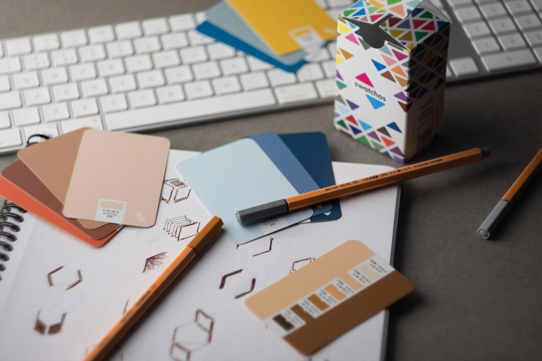 Designer brand color swatch cards with CMYK and RGB shades, representing AI-assisted brand palette and consistent marketing design