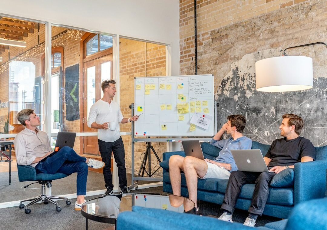 Startup founders discussing business plan representing DPIIT startup recognition