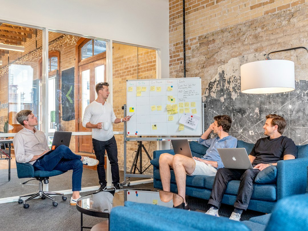 Startup founders discussing business plan representing DPIIT startup recognition