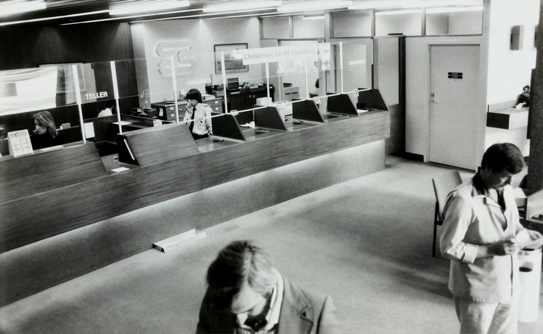 Bank customers and relationship manager illustrating account holder guidance