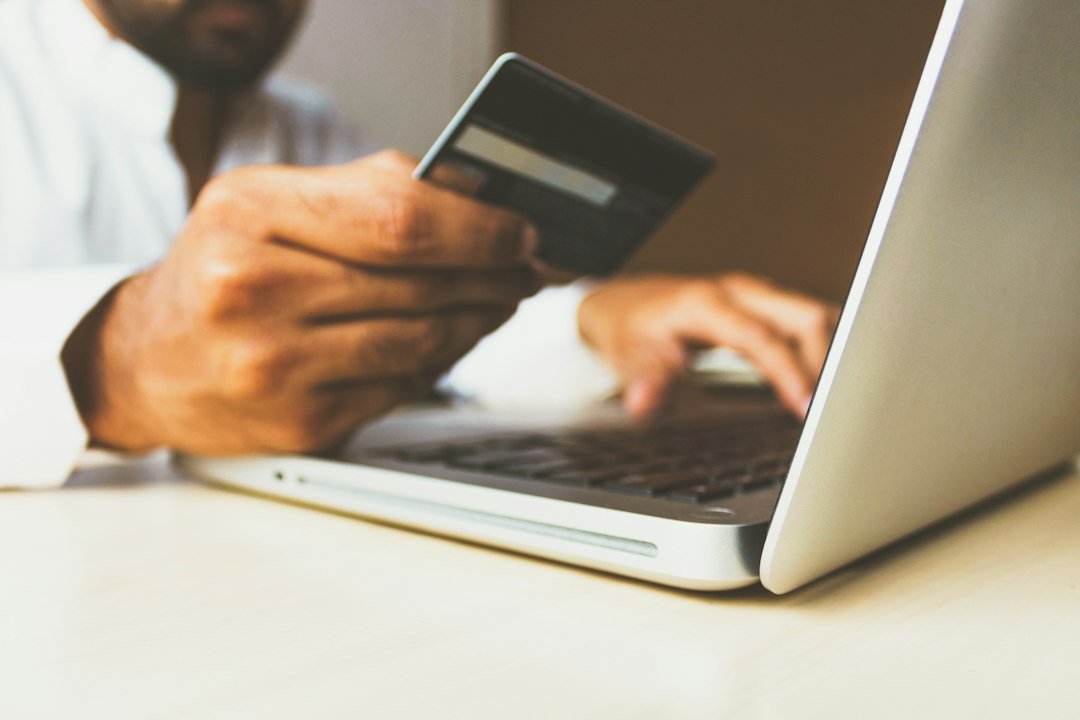 Credit card and laptop depicting secure card tokenisation digital payments