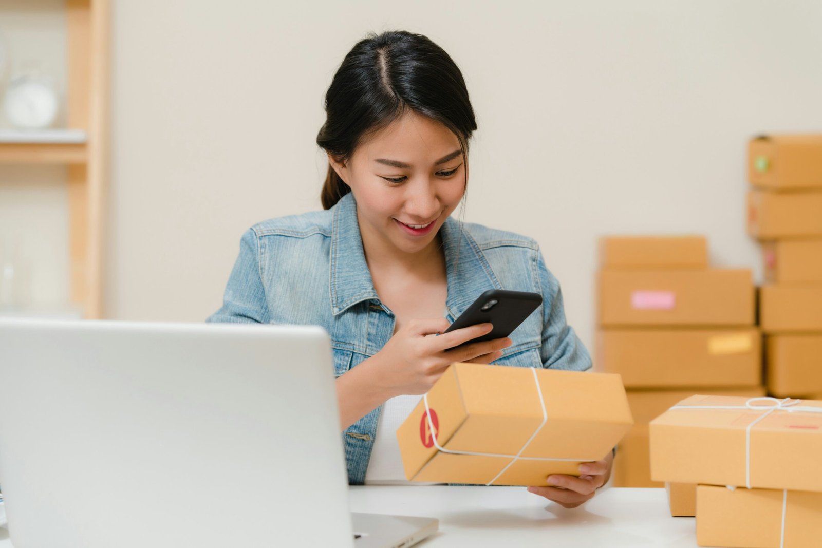 Small business owner checking stock with smartphone for ONDC seller registration guide