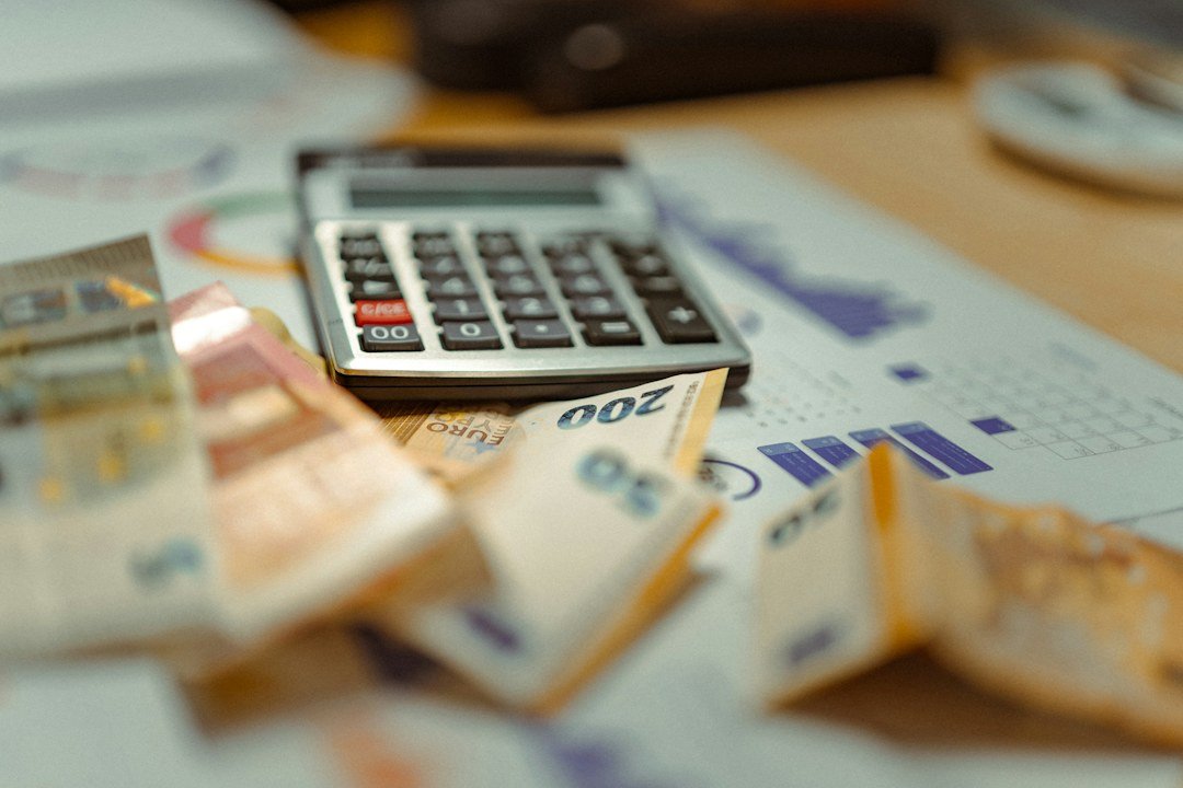 Financial planning paperwork and currency illustrating mutual fund investor costs and regulations; conceptual editorial photograph