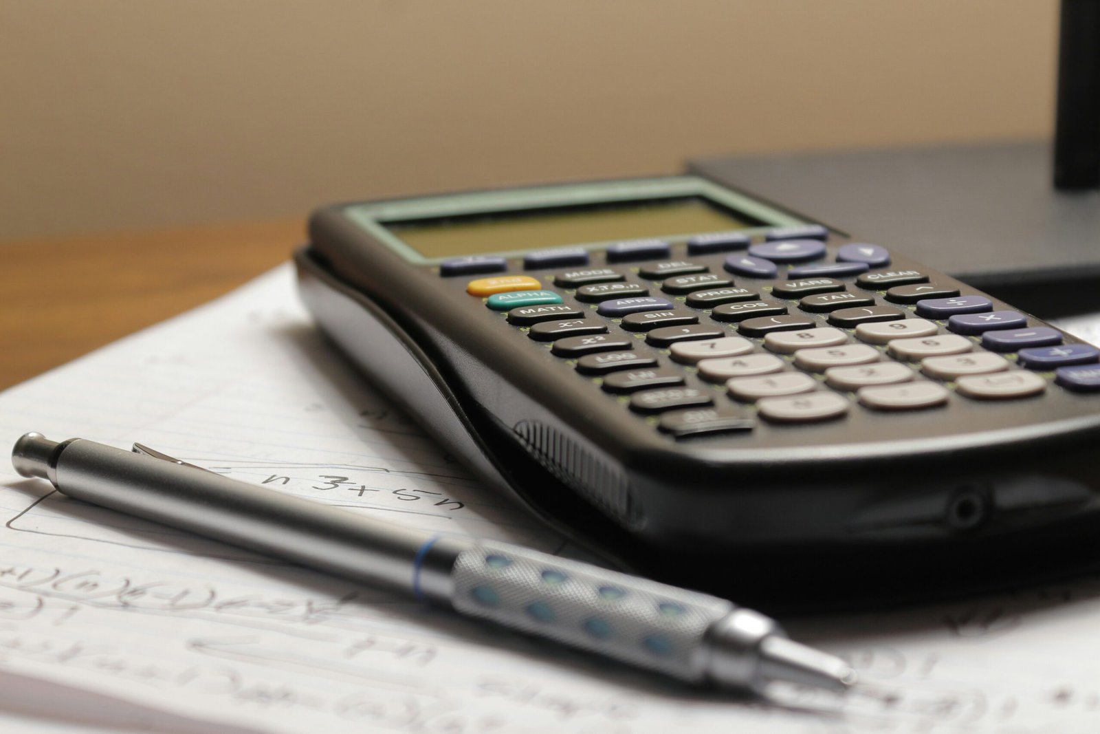 Calculator and finance paperwork illustrating Excel cash flow statement and small business cash forecast