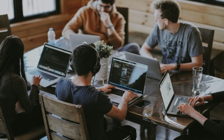 Startup product team planning an MVP around a laptop