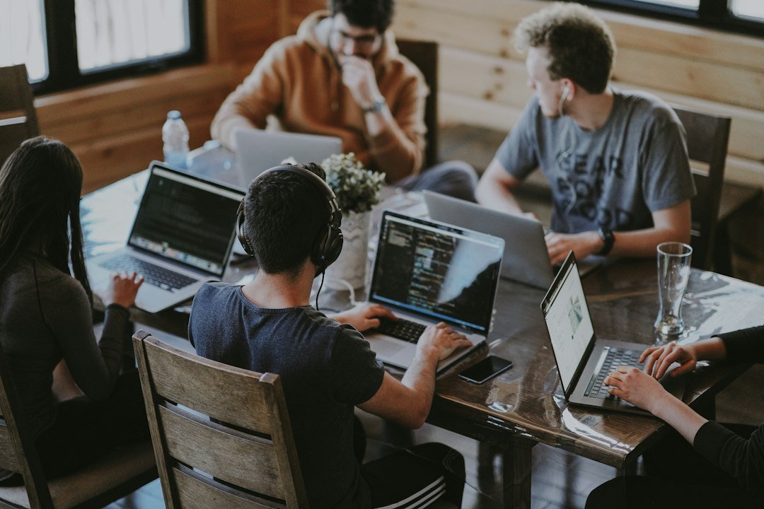 Startup product team planning an MVP around a laptop